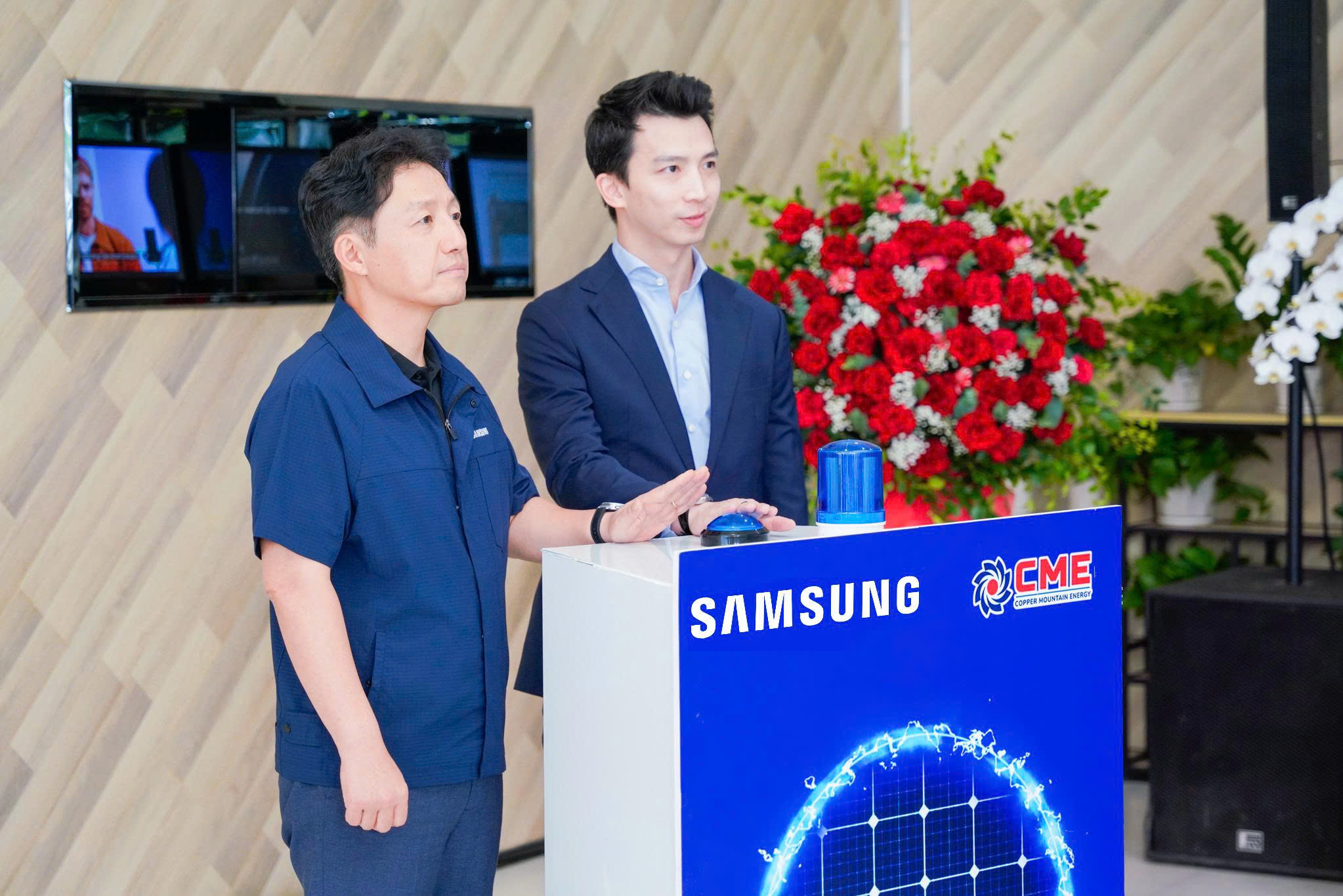 Delegates perform the power-on ritual, officially marking the Commercial Operation Date (COD) of the rooftop solar power system